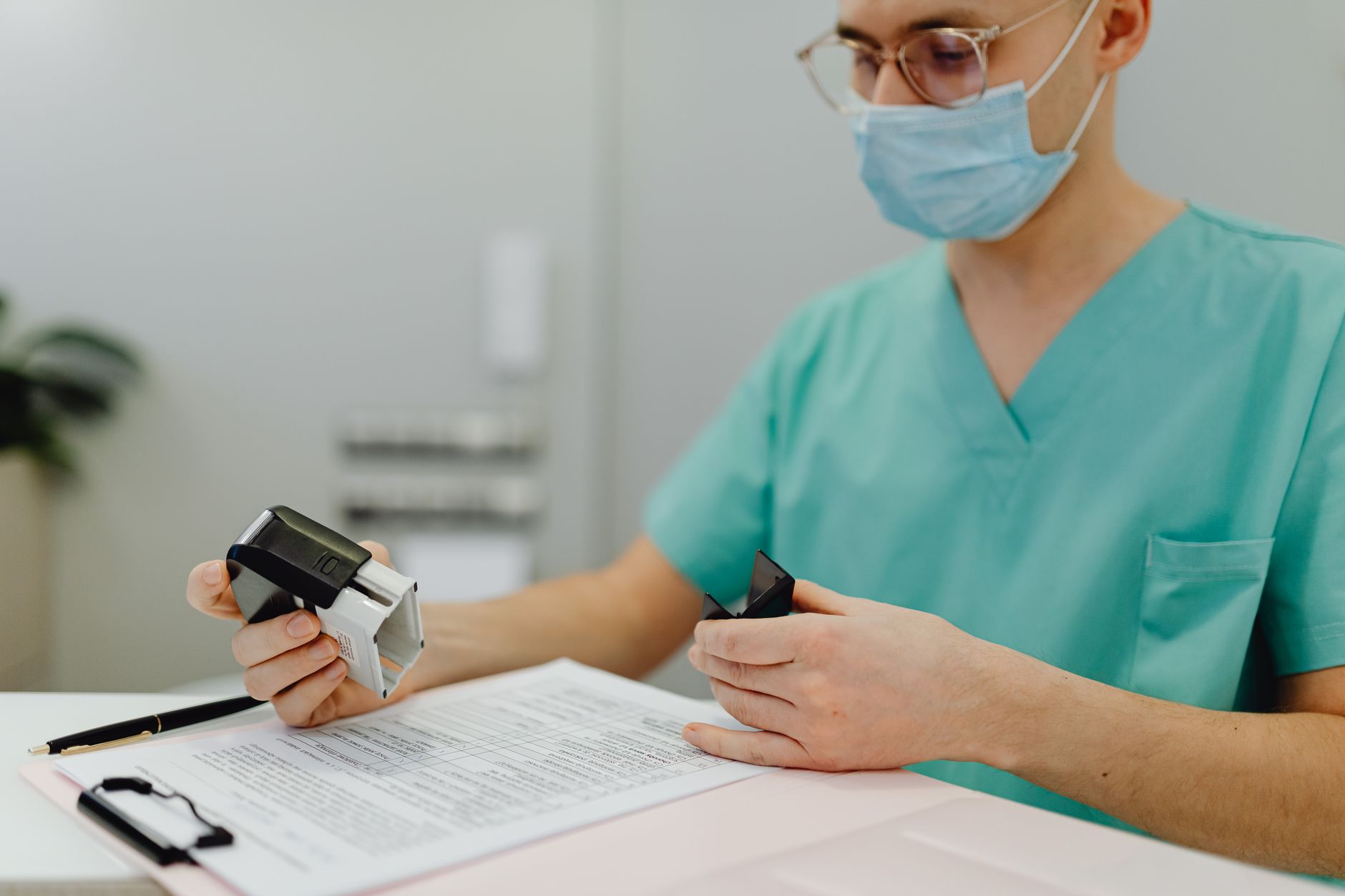 Medical billing and administrative paperwork stacked on an office desk
