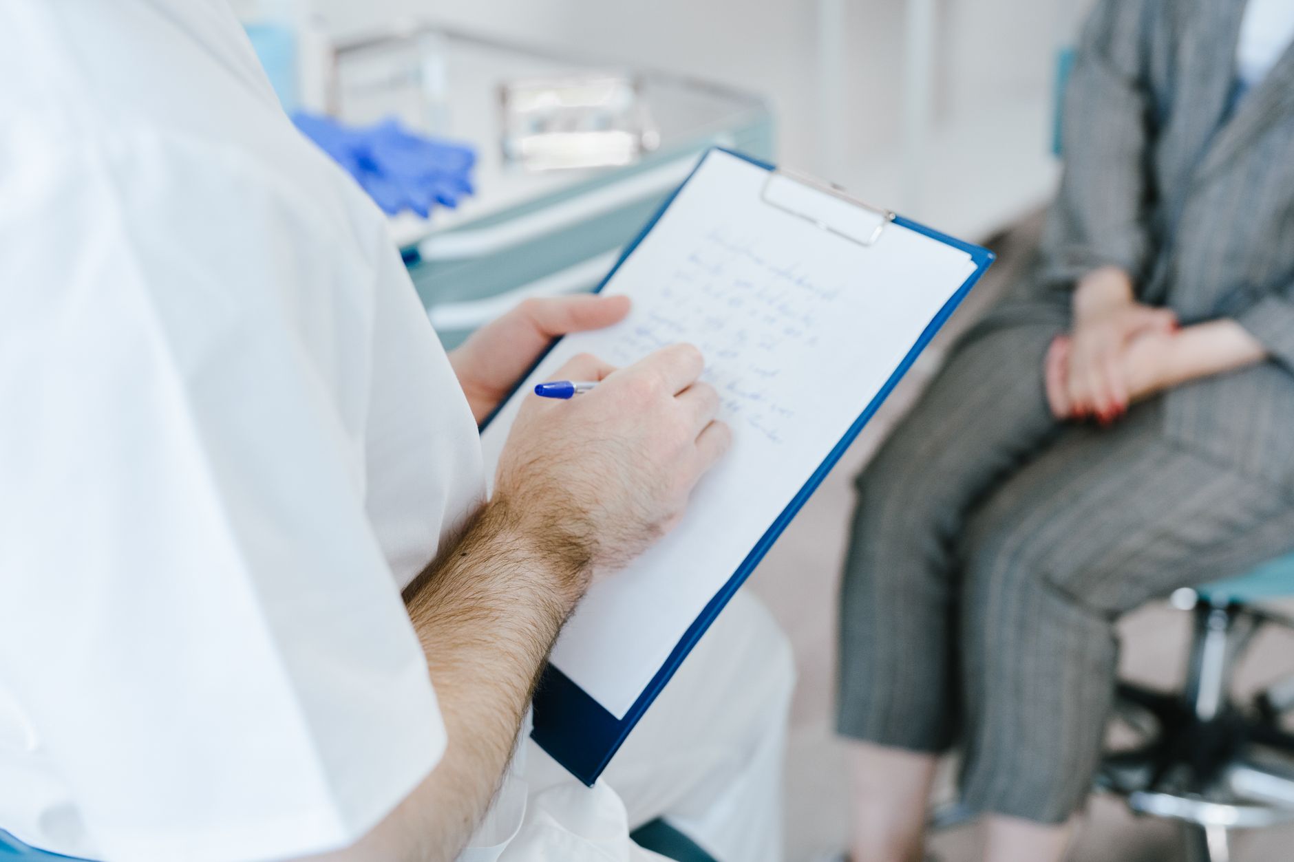 Physicians in discussion at a medical office conference table
