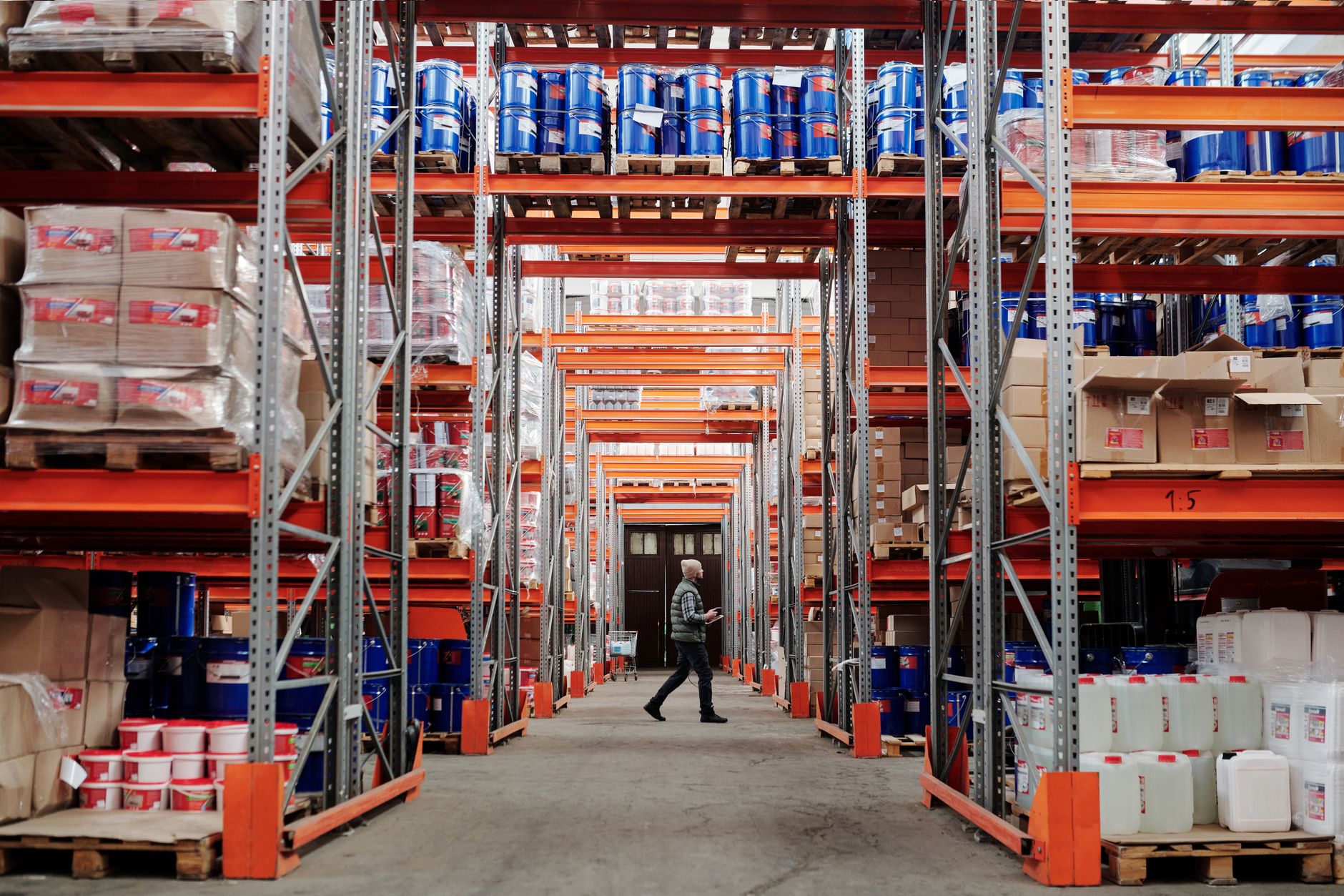 Workers managing freight operations inside a large distribution warehouse