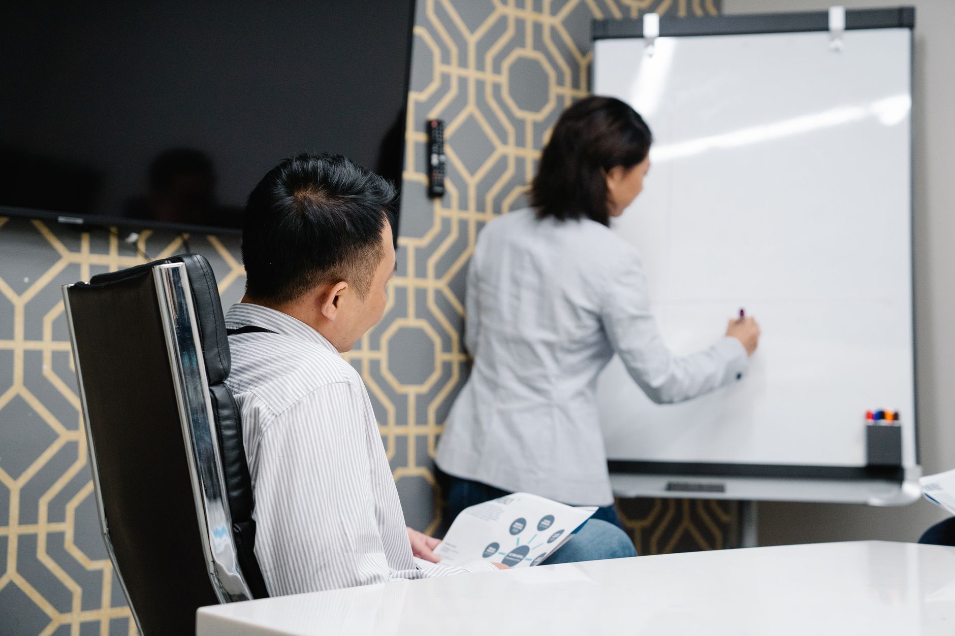 Business professionals reviewing competitive strategy in a conference room
