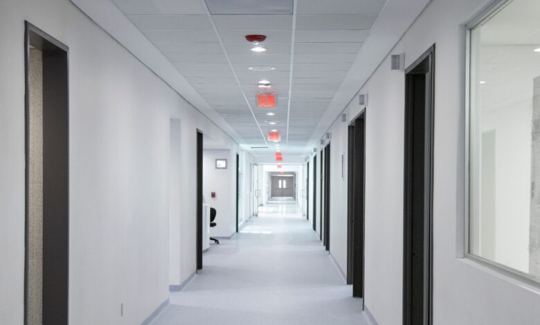Empty hospital corridor representing healthcare facility operations