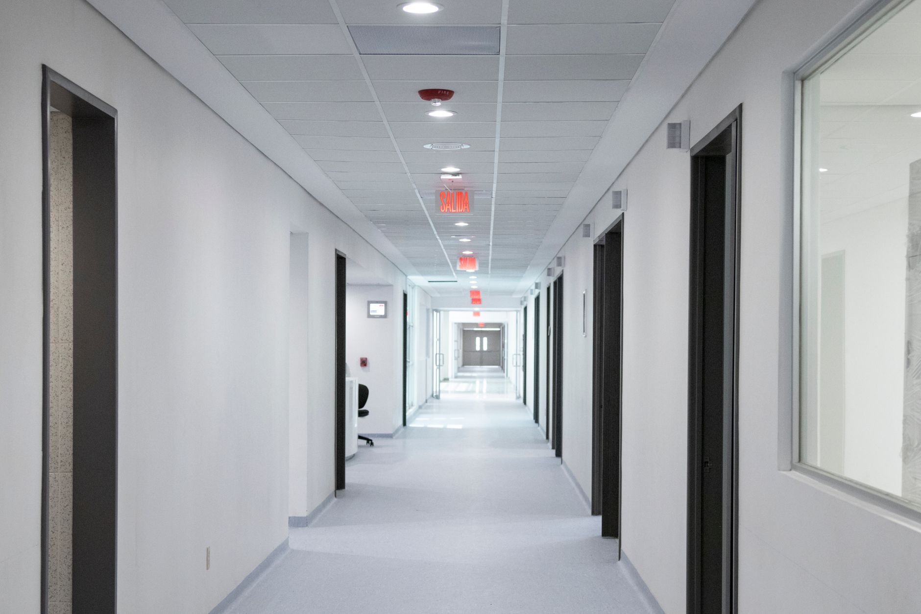 Empty hospital corridor representing healthcare facility operations