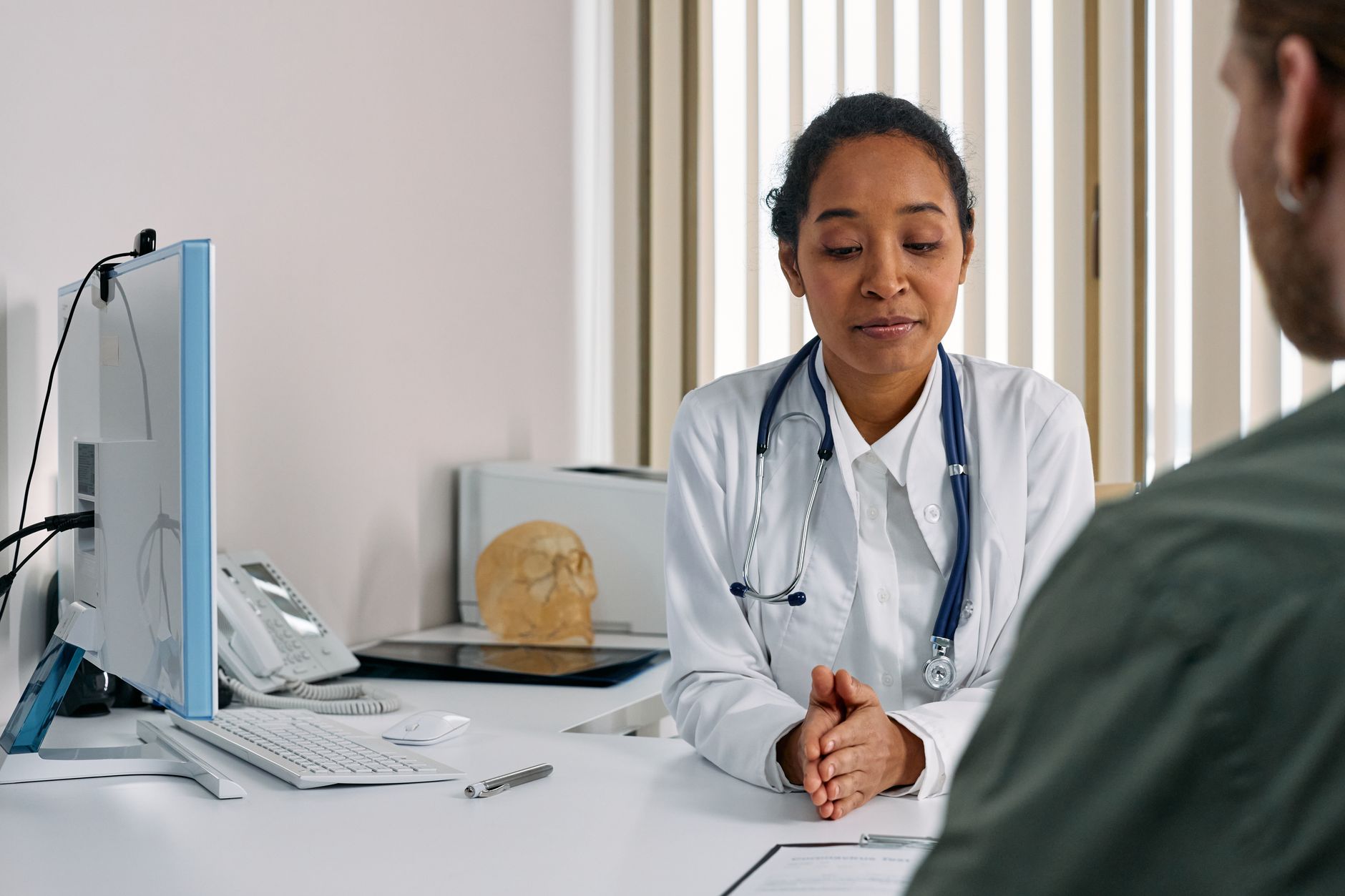 Physician consulting with a patient in a modern medical office setting