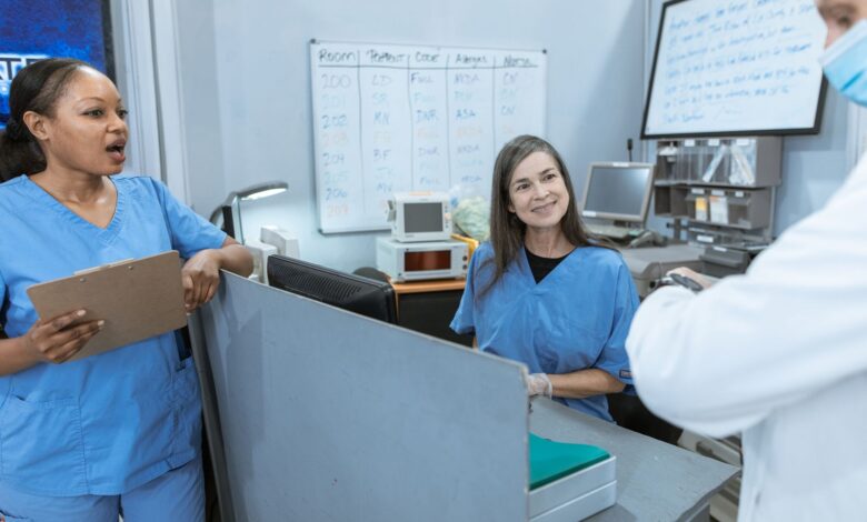 Healthcare staffing professionals reviewing documents in an office setting
