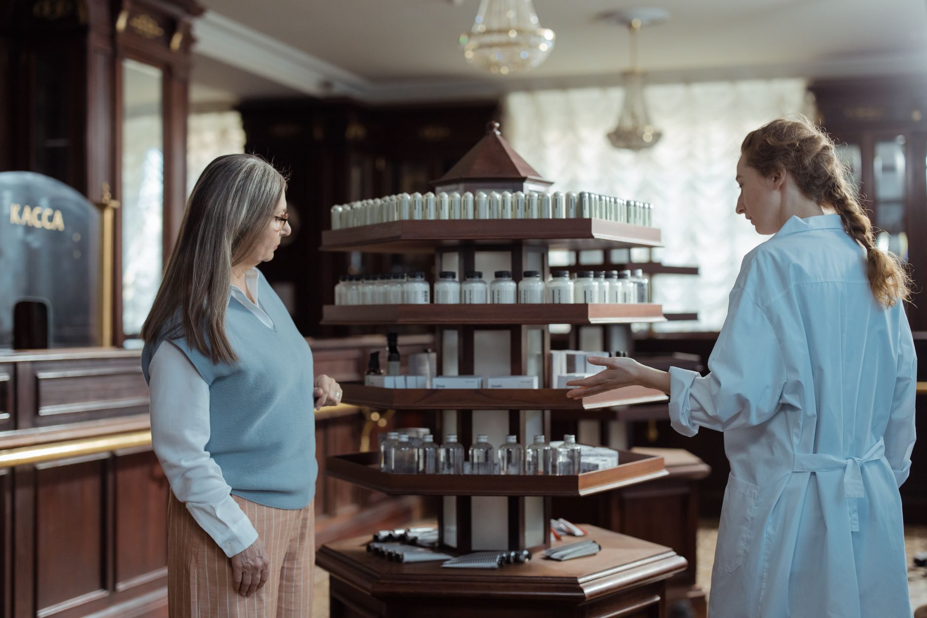 Interior of an independent pharmacy with prescription shelves and dispensing counter