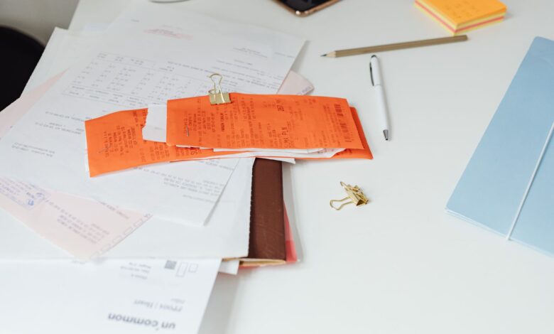 Mortgage documents and paperwork laid out on a desk representing a home loan servicing transaction