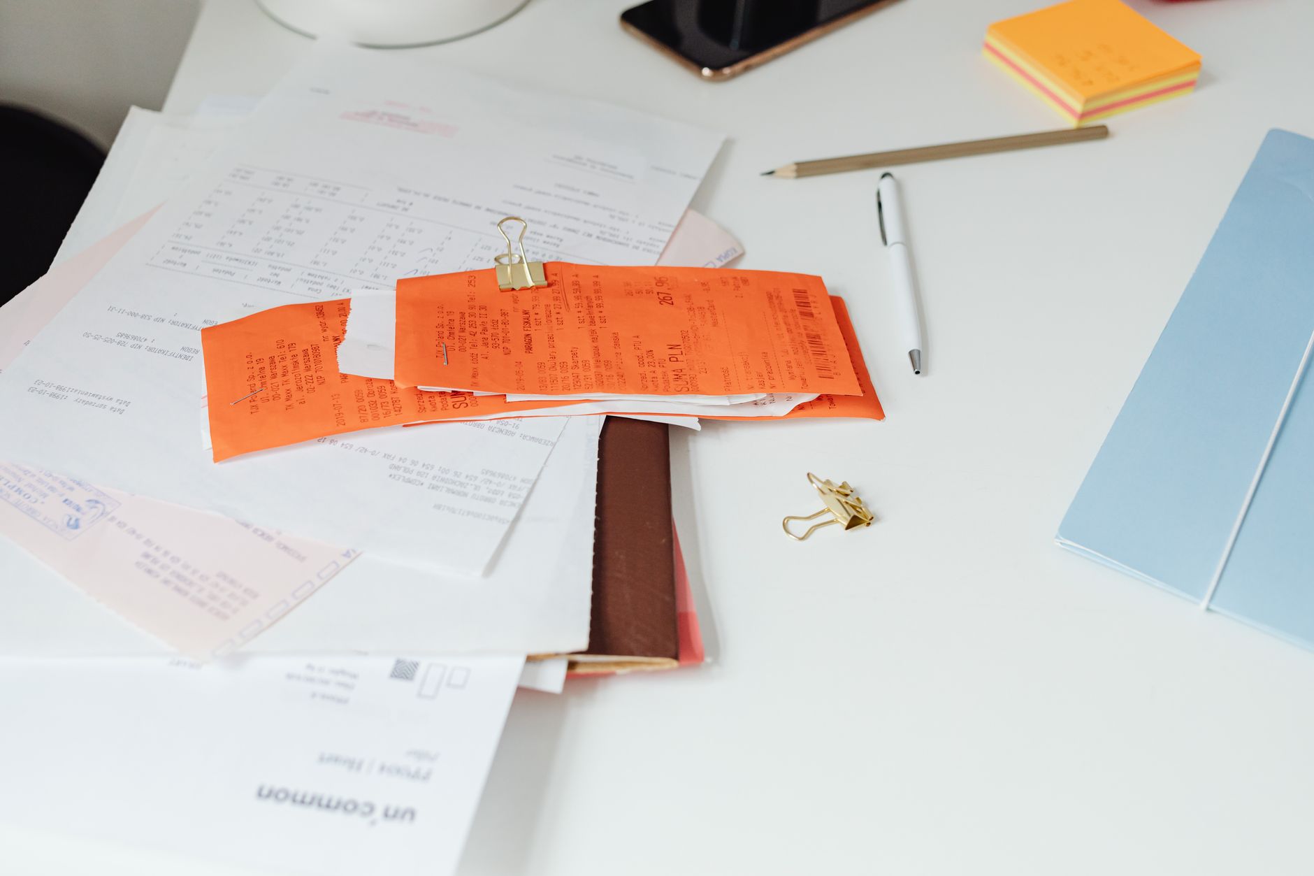 Mortgage documents and paperwork laid out on a desk representing a home loan servicing transaction