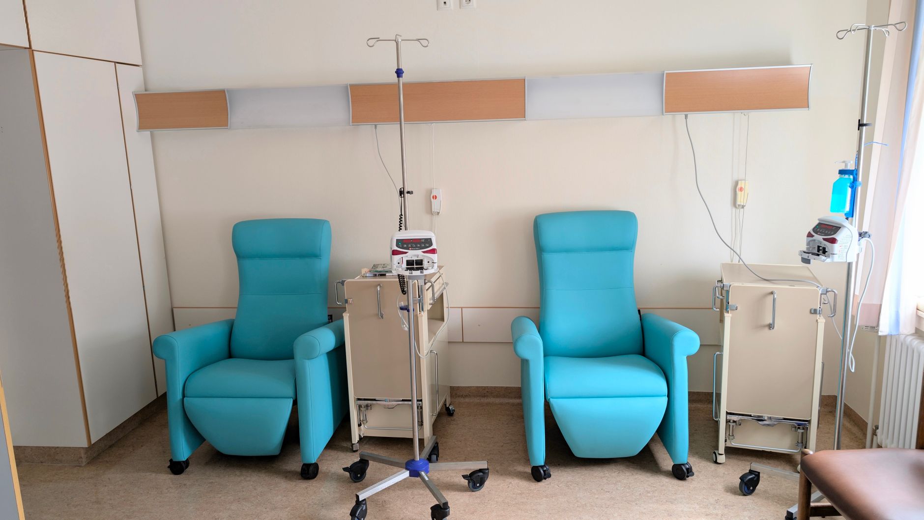 Clean interior of an outpatient medical clinic with reception desk and waiting area