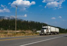 Semi truck driving on a highway representing regional freight transportation