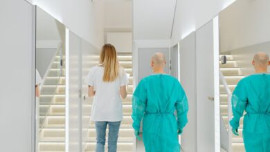 A clean, modern ambulatory surgery center corridor with medical equipment visible