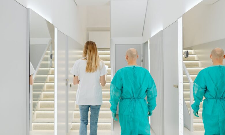 A clean, modern ambulatory surgery center corridor with medical equipment visible