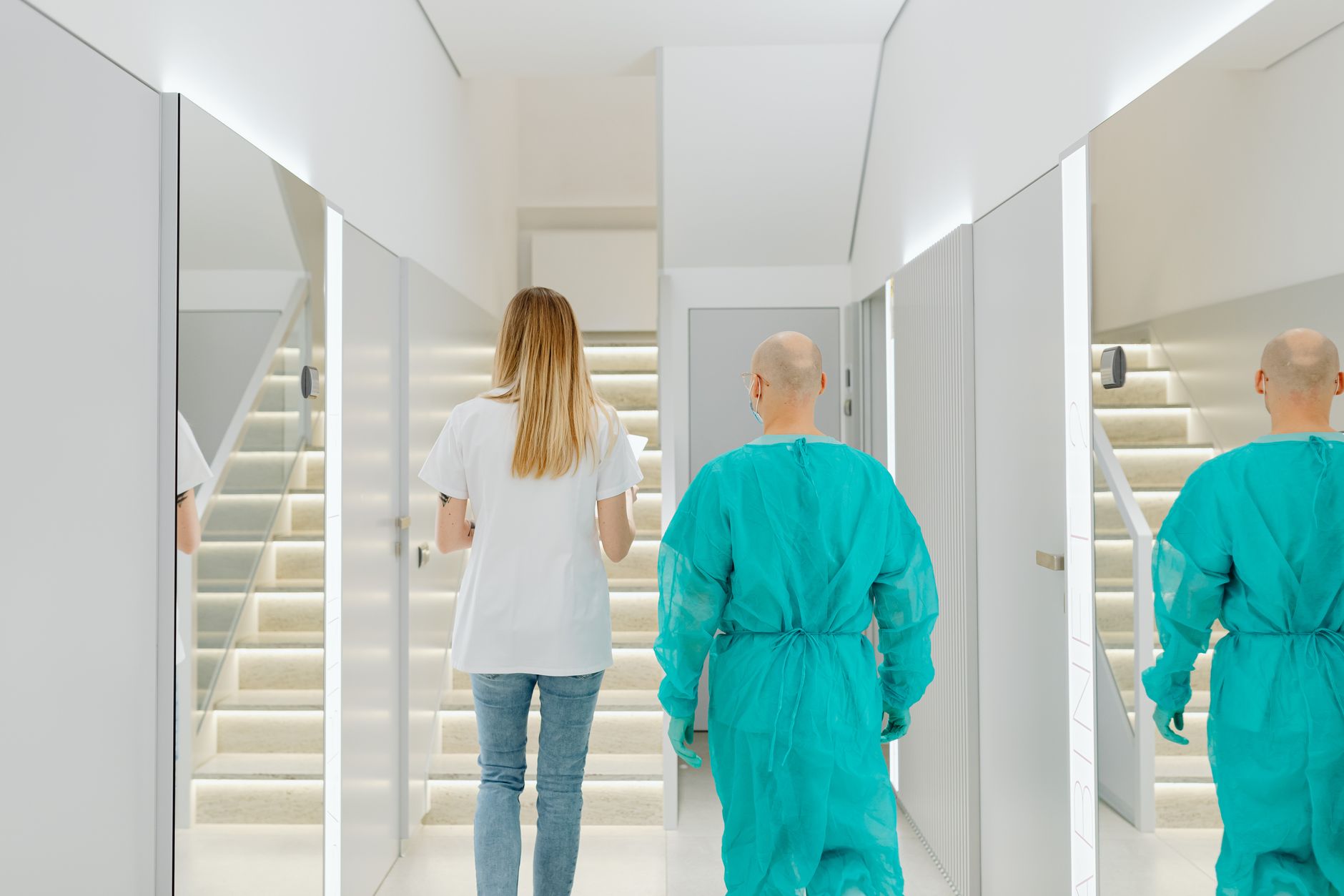 A clean, modern ambulatory surgery center corridor with medical equipment visible