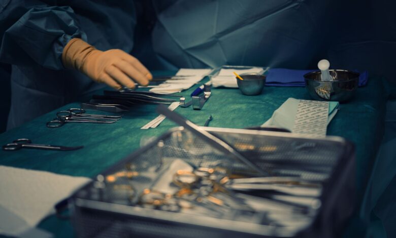 Empty operating room with anesthesia equipment and surgical lighting
