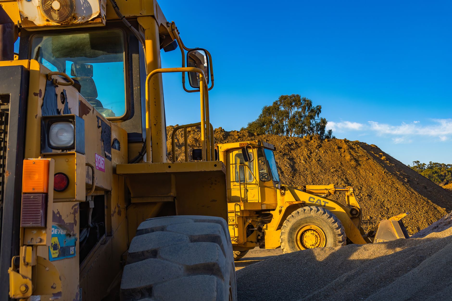 Heavy industrial lifting equipment on a worksite representing crane and rigging operations