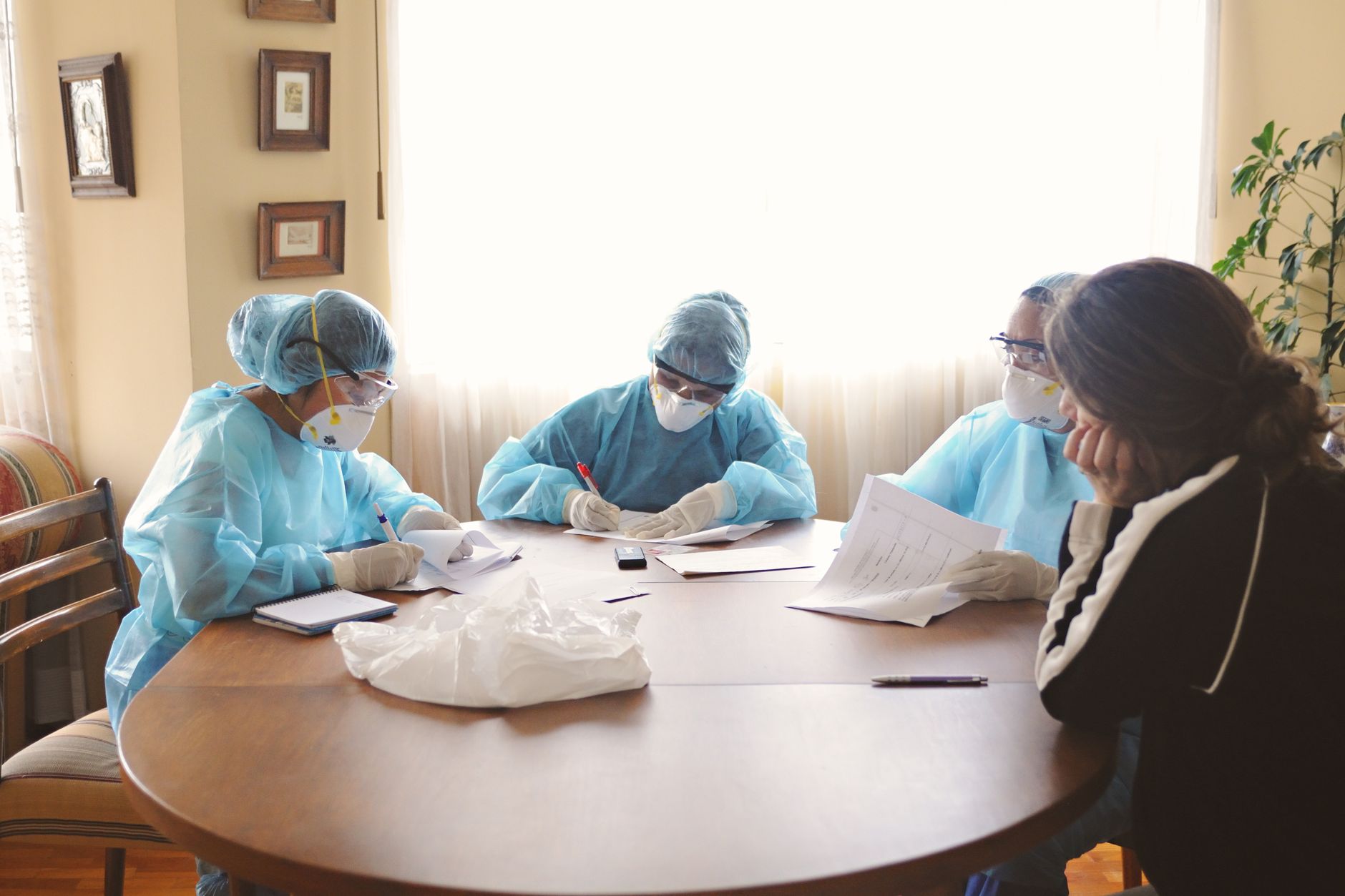 Healthcare administrators in a meeting room discussing business strategy
